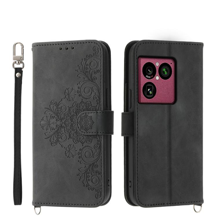 Black embossed floral leather phone wallet case with wrist strap and flip cover
