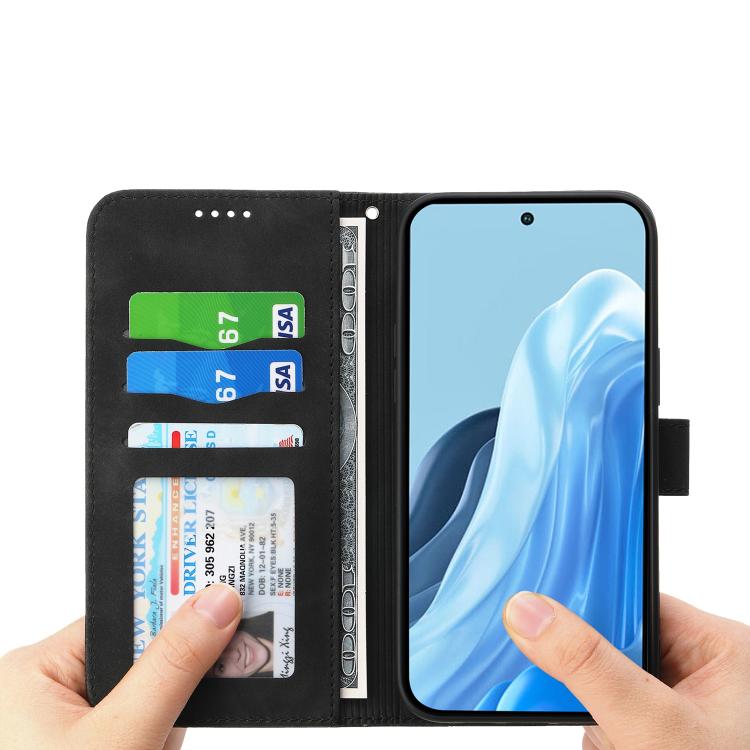 Black flip wallet phone case with card slots and cover holding the phone.