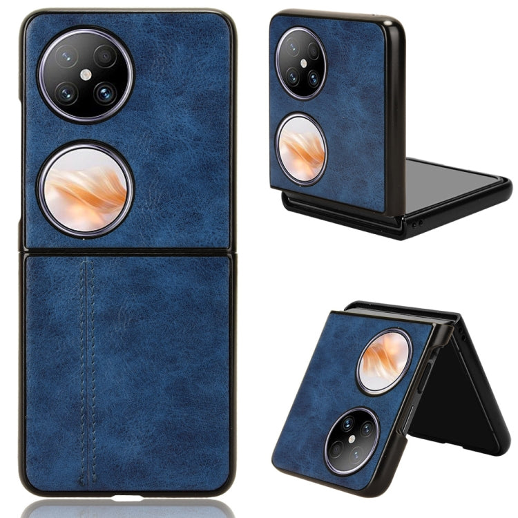 Dark blue faux-leather flip phone case with stitched seam and camera cutouts.