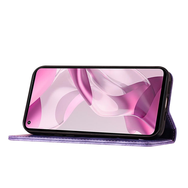 Purple flip leather phone case with embossed cat and butterfly pattern shown in use