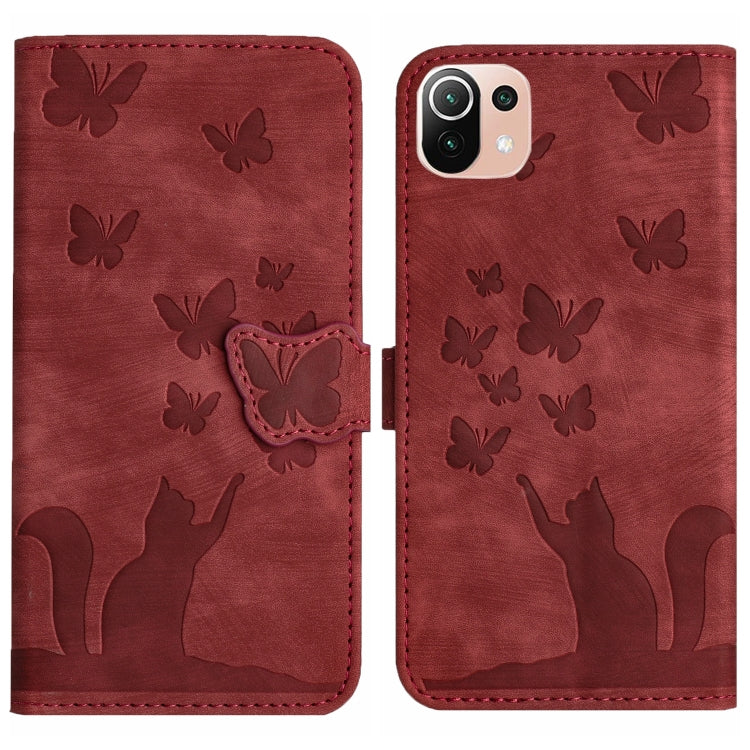 Red embossed butterfly and cat flip leather phone case with snap strap and stitching