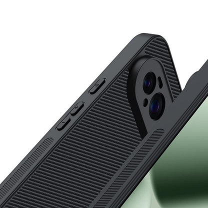 Carbon fiber textured phone case, black, close-up of side buttons and camera module.