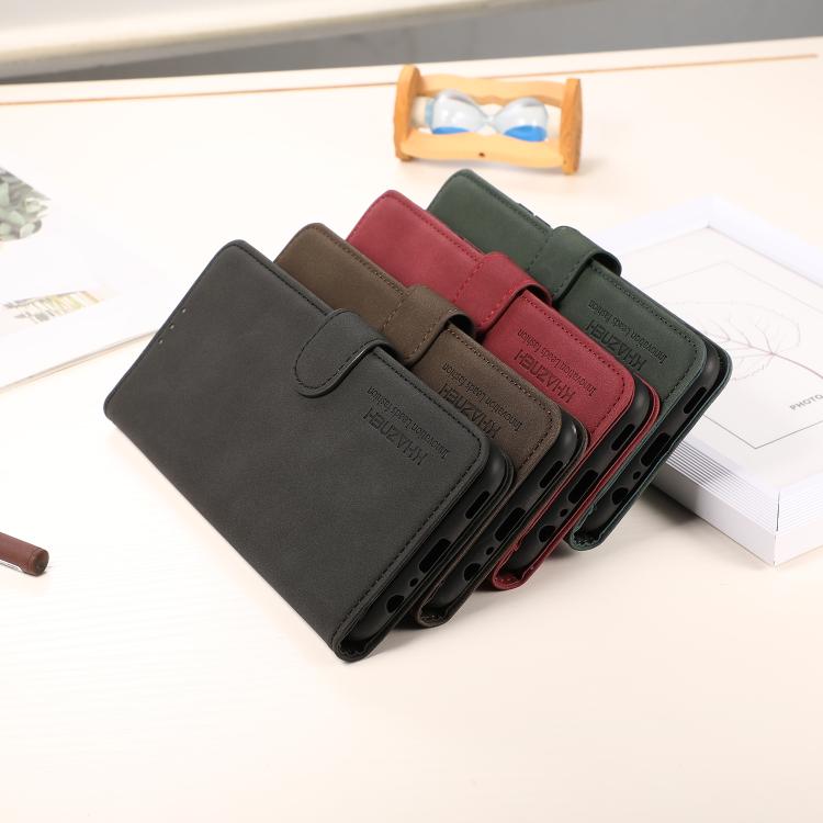 Set of matte leather folio phone cases in dark, brown, red, and green colors