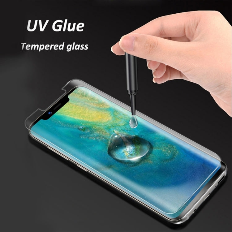 UV tempered glass screen protector being applied with UV glue to smartphone screen