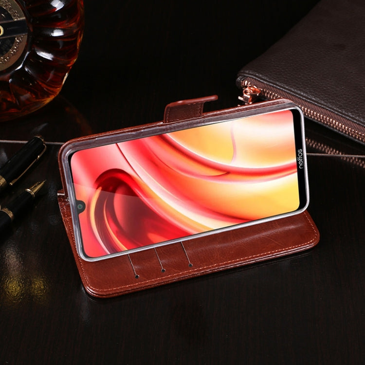 Brown leather flip phone case holding a phone with colorful display