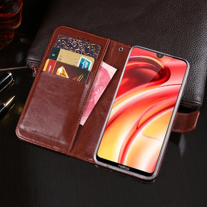 Brown leather flip phone case with card slots open and phone screen visible