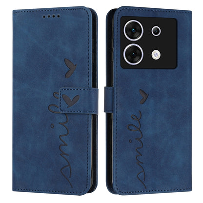 Blue leather wallet phone case with heart embossing, stitched heart-and-name script, flip strap