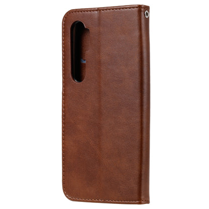 Brown leather phone case with camera cutout and stitched edge