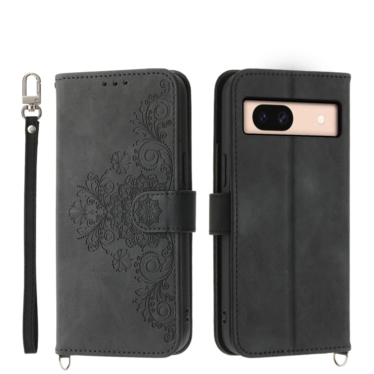Dark gray embossed leather wallet phone case with floral pattern and wrist strap