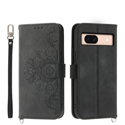 Dark gray embossed leather wallet phone case with floral pattern and wrist strap