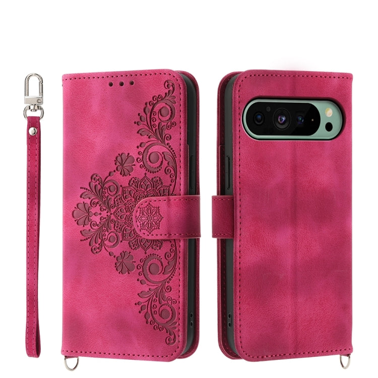 Magenta embossed floral leather wallet phone case with wrist strap and flip cover