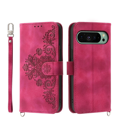 Magenta embossed floral leather wallet phone case with wrist strap and flip cover