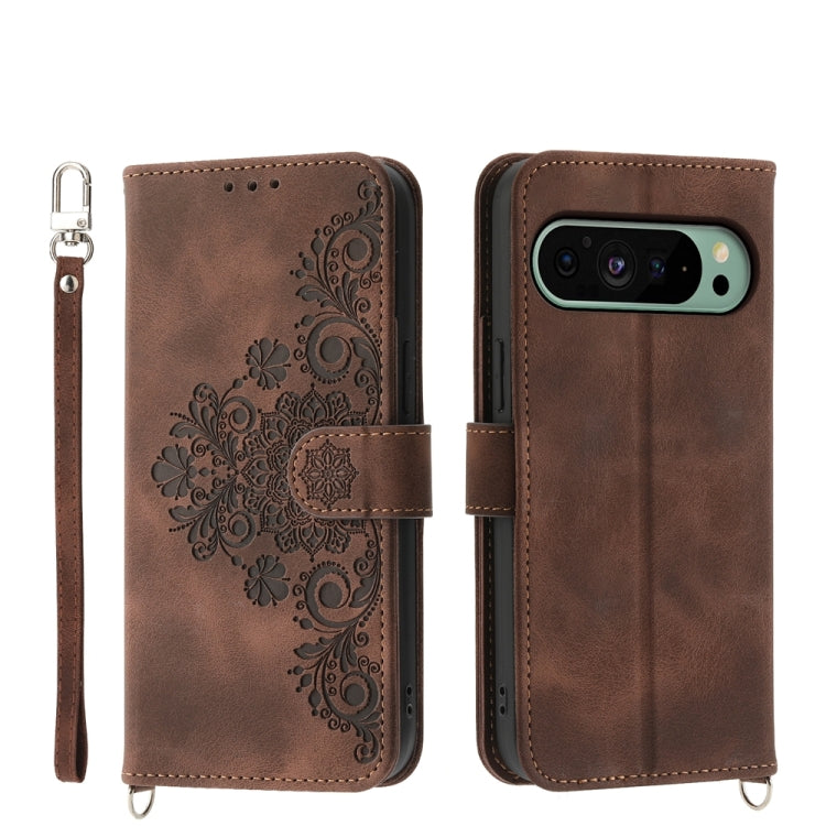 Brown embossed floral leather wallet phone case with wrist strap and flip cover