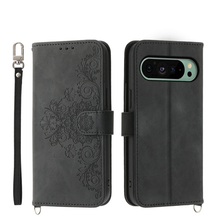 Embossed leather wallet phone case in dark gray with floral pattern and wrist strap