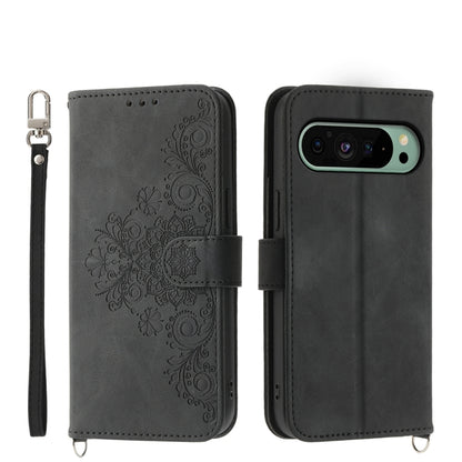 Embossed leather wallet phone case in dark gray with floral pattern and wrist strap