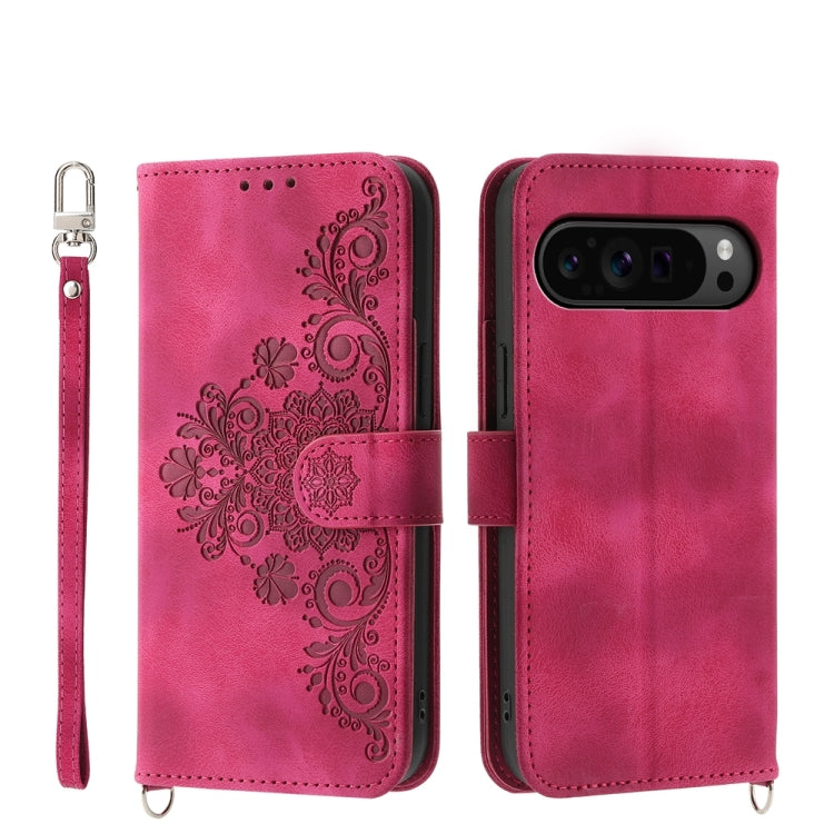 Magenta embossed floral leather wallet phone case with wrist strap and flip cover