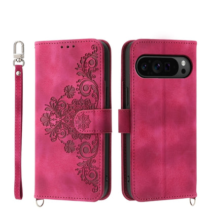 Magenta embossed floral leather wallet phone case with wrist strap and flip cover