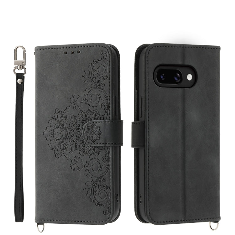 Black embossed floral leather wallet phone case with wrist strap and flip cover
