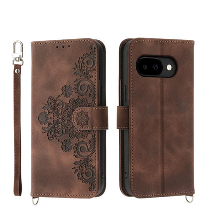 Brown leather phone wallet case with embossed floral pattern and wrist strap