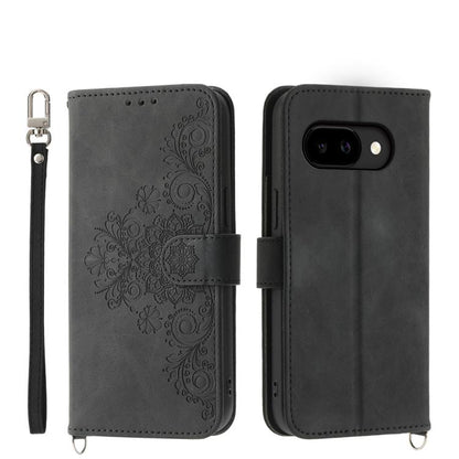 Dark gray leather phone wallet case with embossed floral pattern and wrist strap
