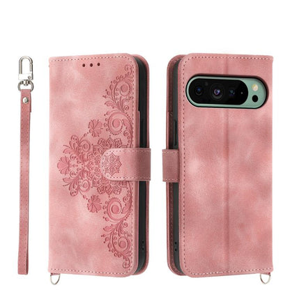 Pink leather phone wallet case with embossed floral pattern, wrist strap, camera cutout