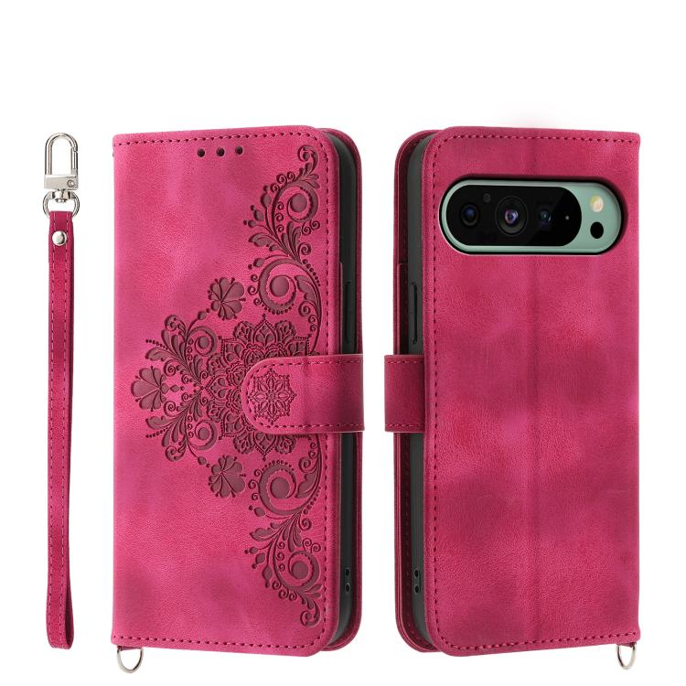 Magenta leather phone wallet case with embossed floral pattern, wrist strap, camera cutout