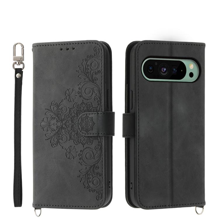 Dark gray leather phone wallet case with embossed floral pattern and wrist strap