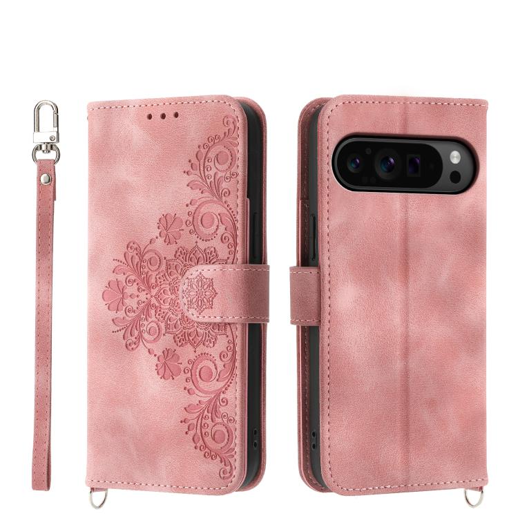 Pink leather phone wallet case with embossed floral pattern and wrist strap, magnetic flap