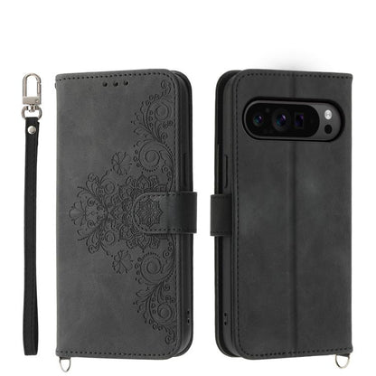 Dark gray leather phone wallet case with embossed floral pattern, wrist strap, magnetic flap