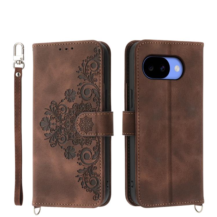 Brown embossed floral wallet phone case with flip cover and wrist strap