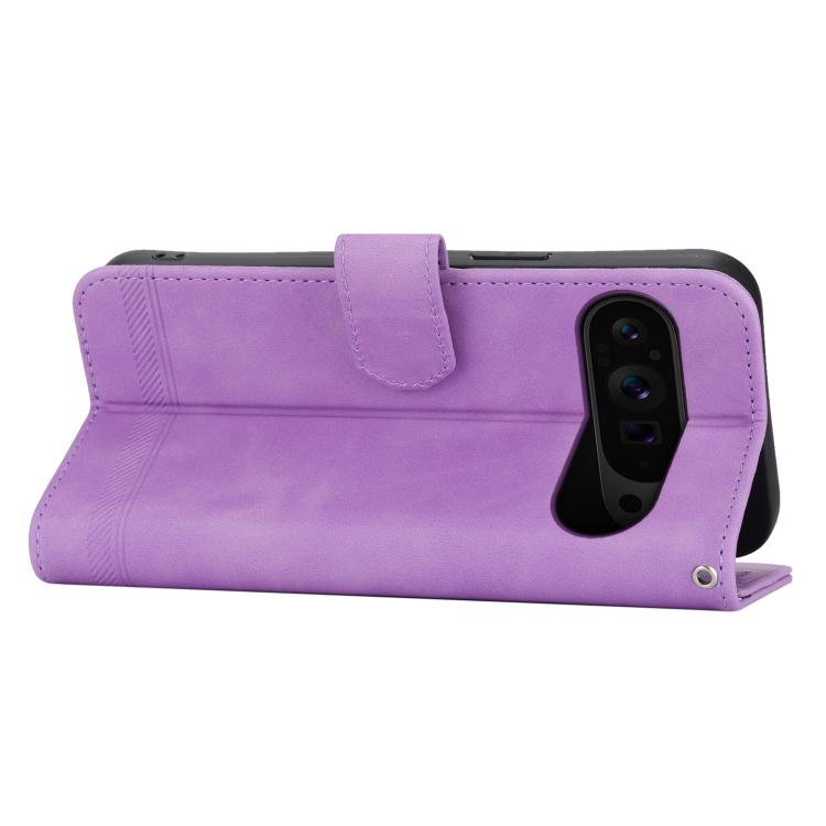Purple wallet-style flip phone case with front cover flap and camera cutout