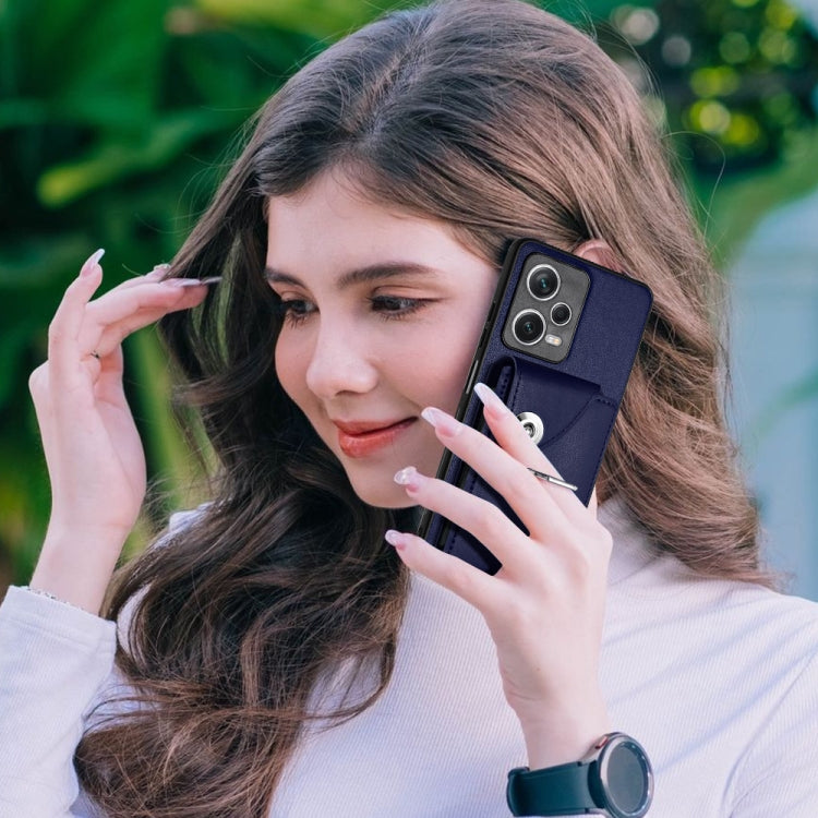 Blue PU wallet phone case with ring holder and card pocket flap, shown on a person’s phone.