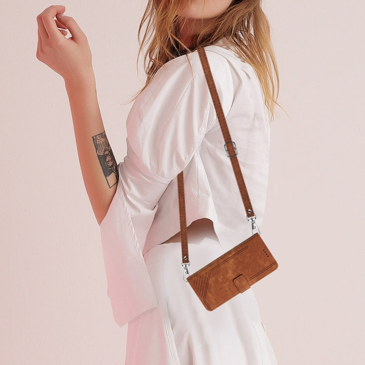 Brown leather-look phone wallet case with lanyard worn crossbody by person