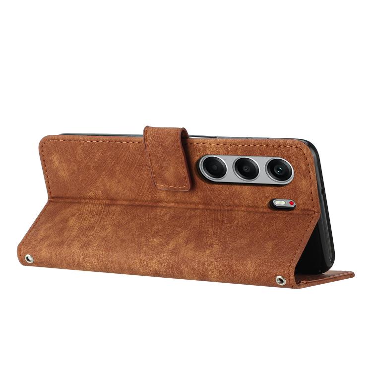 Brown leather wallet-style phone case with stripe pattern and camera cutouts