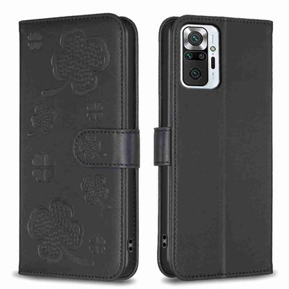 Dark four-leaf embossed leather phone case with flip strap and camera cutout