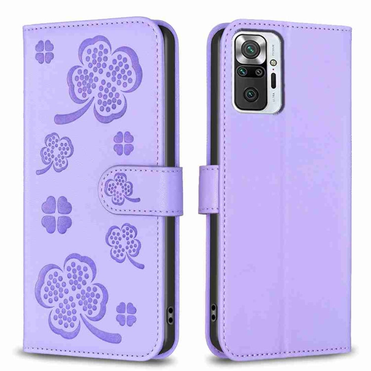 Light purple four-leaf embossed leather phone case with flip strap and cutouts