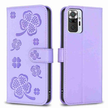 Light purple four-leaf embossed leather phone case with flip strap and cutouts