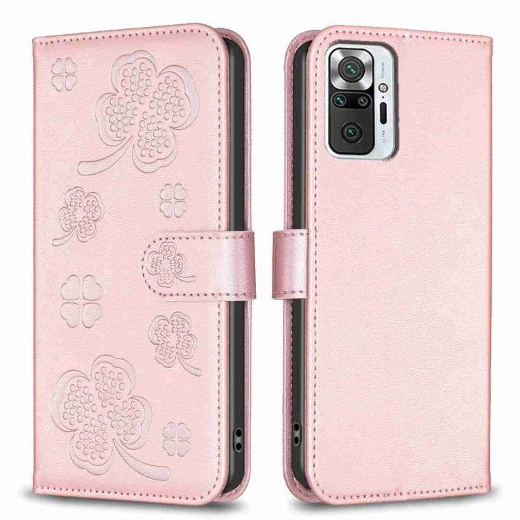 Pink four-leaf embossed leather phone case with flip strap and camera cutout