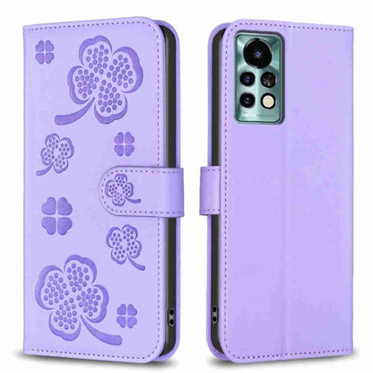 Light purple four-leaf embossed leather phone case, folio strap, camera cutout.