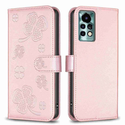 Pink four-leaf embossed leather phone case, folio strap, camera cutout.