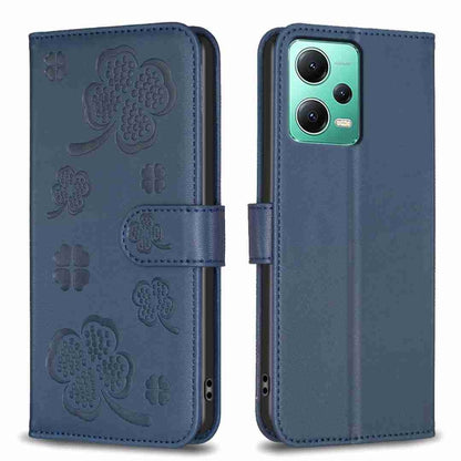 Blue embossed leather-style phone case with four-leaf clover pattern and folio flap