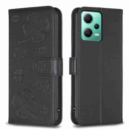Black embossed leather-style phone case with four-leaf clover pattern and folio flap