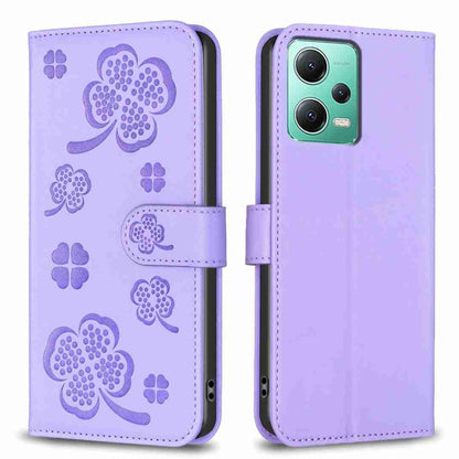 Lavender embossed leather-style phone case with four-leaf clover pattern and folio flap