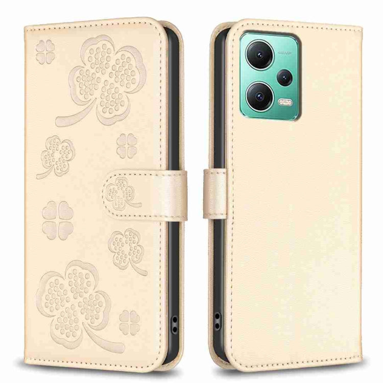 Beige embossed leather-style phone case with four-leaf clover pattern and folio flap