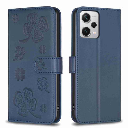 Blue embossed four-leaf clover leather phone case with flip cover and side cutouts