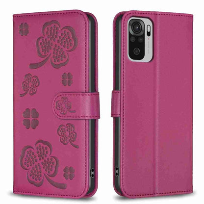 Magenta embossed four-leaf clover leather wallet phone case with magnetic flap.
