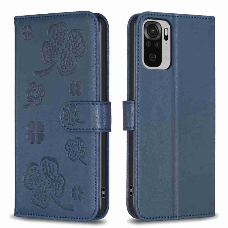 Blue embossed four-leaf clover leather wallet phone case with magnetic flap.