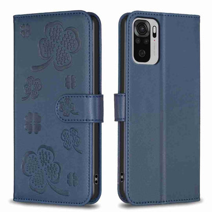 Blue embossed four-leaf clover leather wallet phone case with magnetic flap.