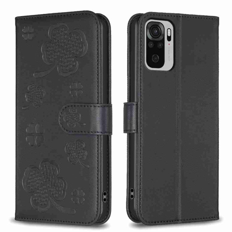 Dark gray embossed four-leaf clover leather wallet phone case with magnetic flap.
