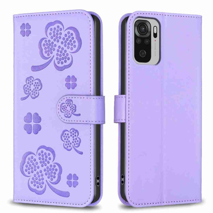 Lavender embossed four-leaf clover leather wallet phone case with magnetic flap.